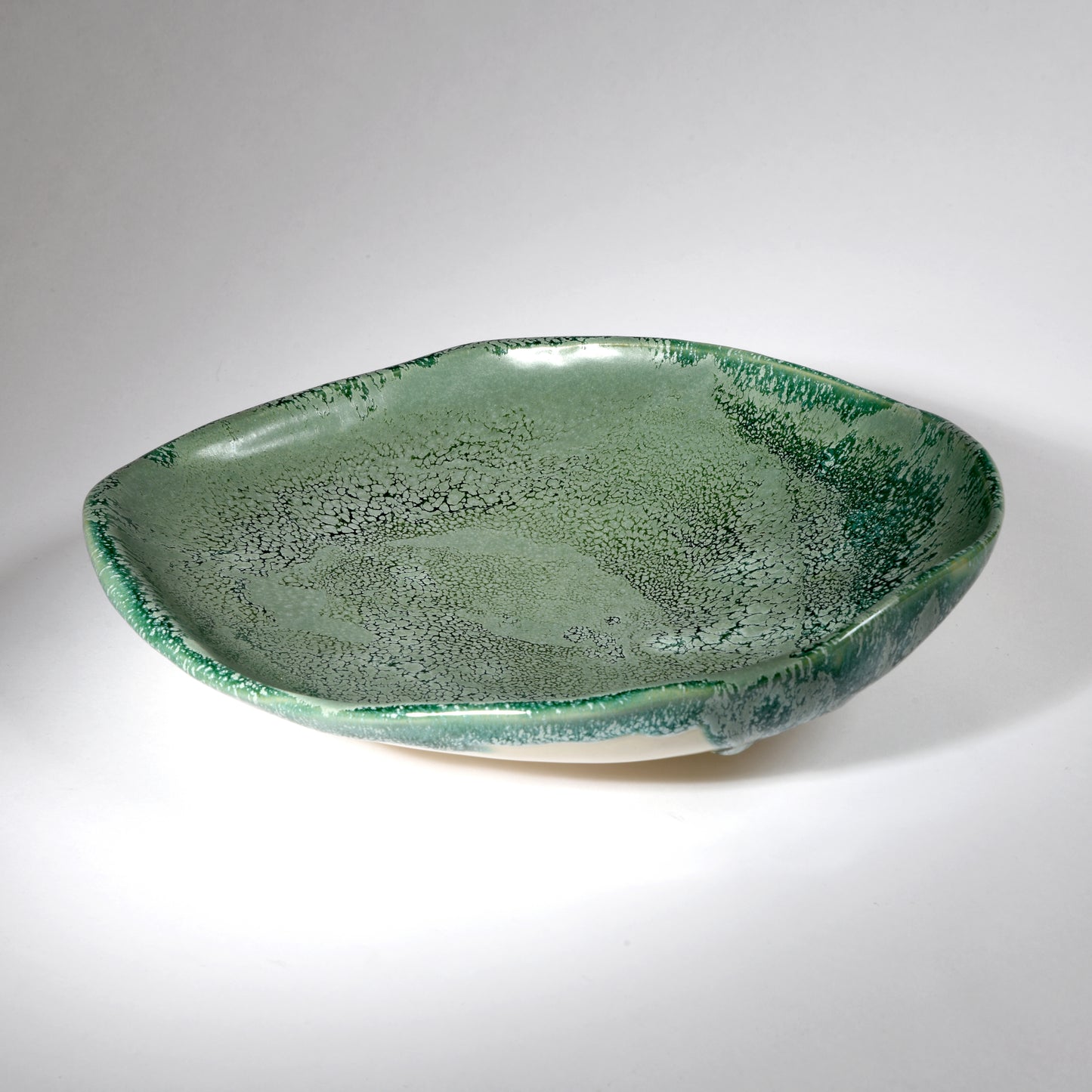 Handmade plate in a beautiful sea foam glaze.