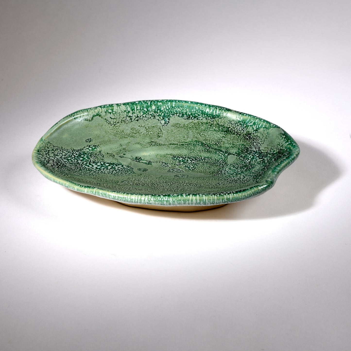 Handmade plate in a beautiful sea foam glaze.