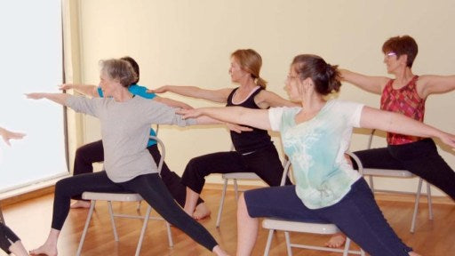 Seated yoga Warrior 2 pose