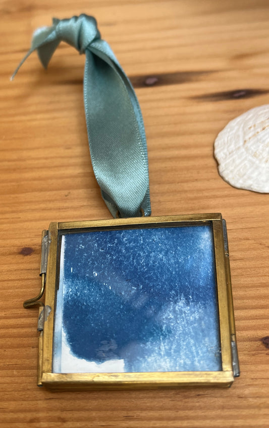 back has hazy cloud cyanotype.