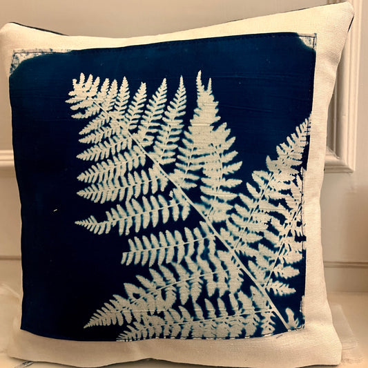 <p>A striking handmade cushion featuring an original Fern cyanotype print.</p> <p>&nbsp;Each cyanotype piece is made individually by me so every one is an original.</p> <p>The cushion is made in a cotton canvas fabric.&nbsp;</p> <p>The front is Ivory and the back is Indigo Blue.</p>