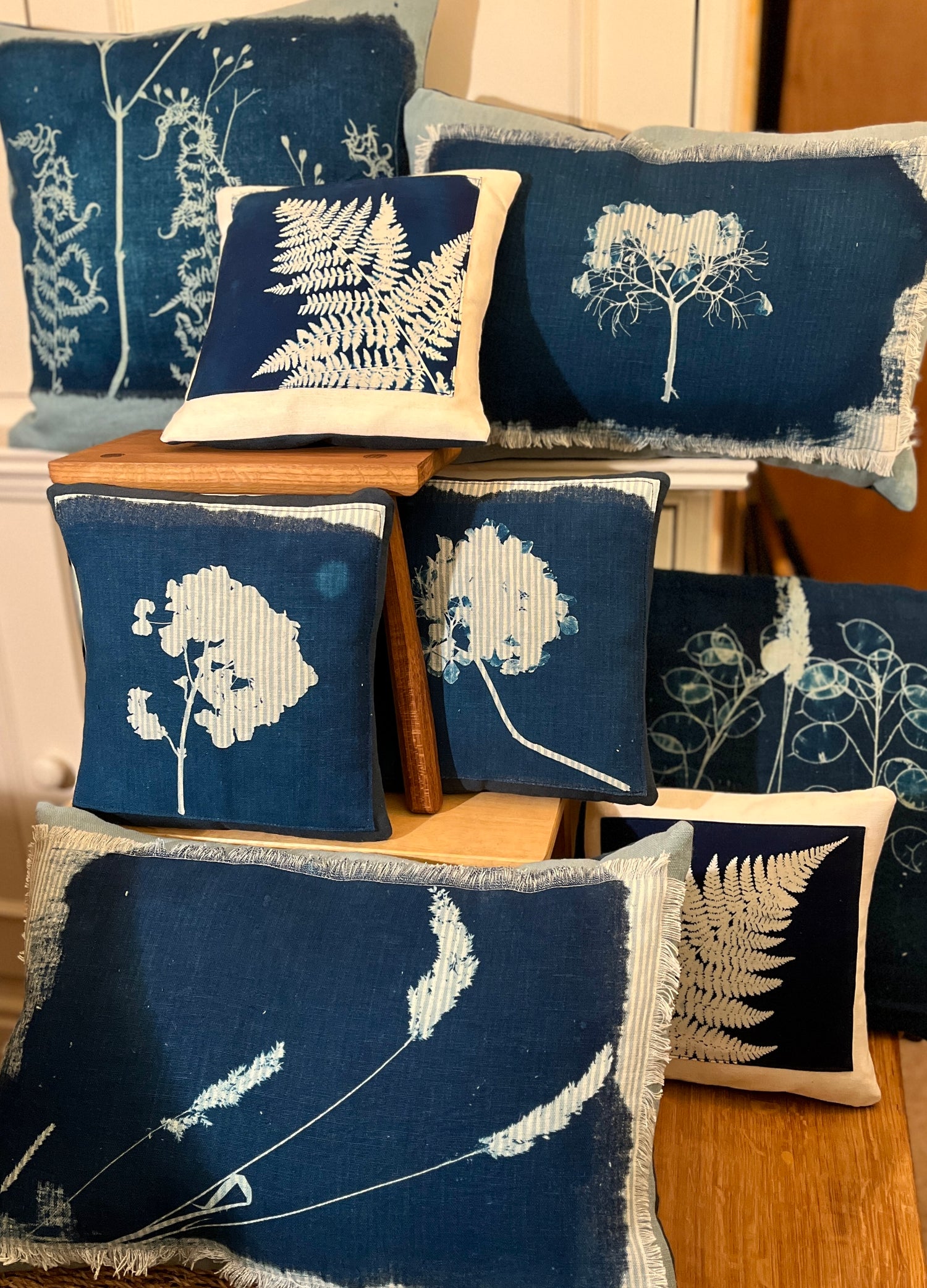 <p>A unique handmade cushion featuring original cyanotype print. Each cyanotype piece is made individually by me so every one is an original. The cushion is in aqua and ivory striped linen.>
