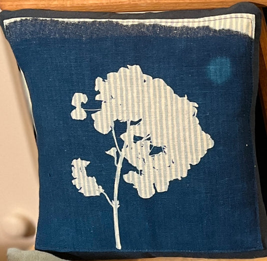 <p>A unique handmade cushion featuring original cyanotype print on a striped linen panel. Each cyanotype piece is made individually by me so every one is an original.</p> <p>The cushion is made in indigo blue cotton canvas.