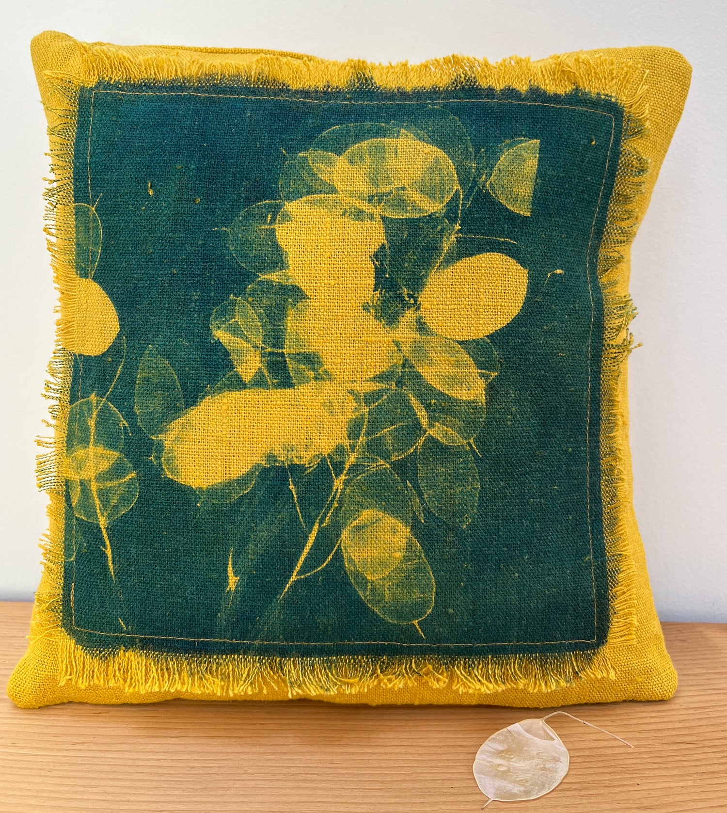 hand printed cushion in gold linen