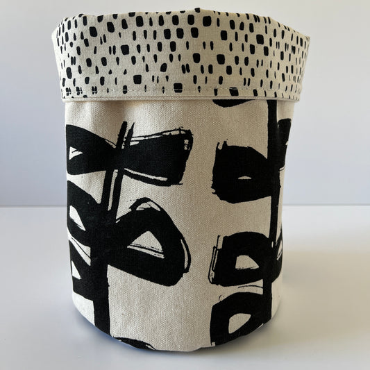 Contemporary and stylish fabric storage pots, in pure linen and hand printed in Cumbria by Kirsten Gilder. Ecru and black. Useful and eye catching in 2 designs.  Contrast hand printed lining.