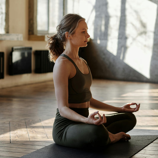 Yoga cross leg pose with hand mudra