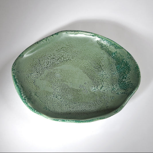 Handmade plate in a beautiful sea foam glaze.