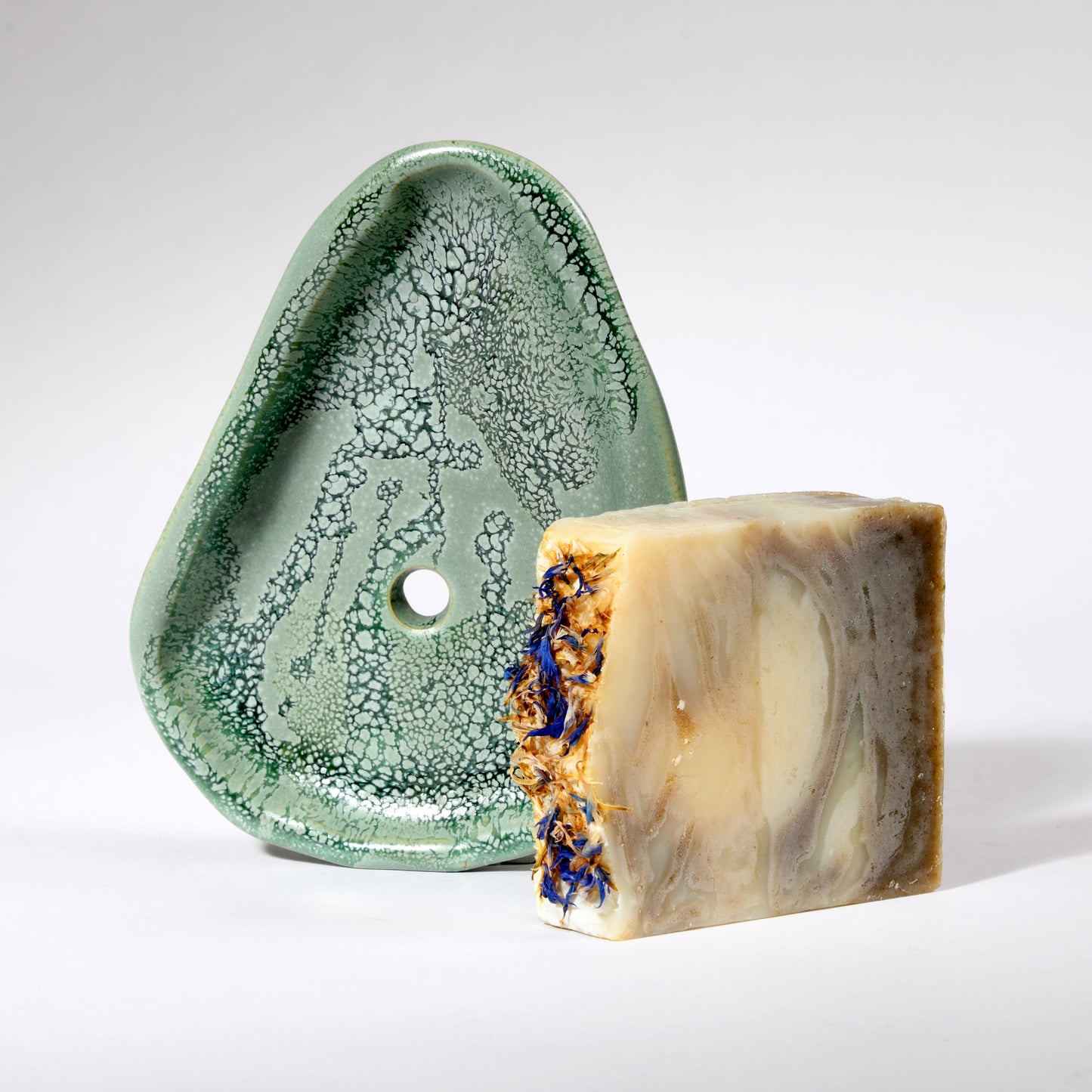 Handmade soap dish with drain hole in a beautiful sea foam glaze