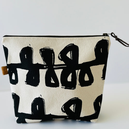 Bag or pouch in hand printed linen in Stem design. Made in Cumbria. Stylish in ecru and black. Printed inner lining.