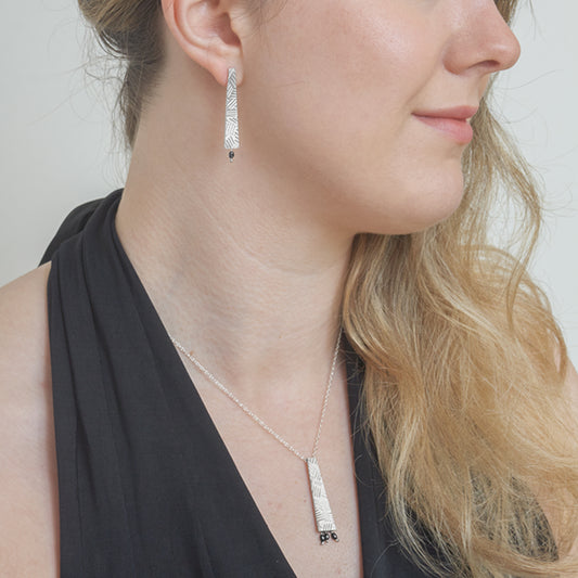 Silver cross hatch necklace with blue pearls