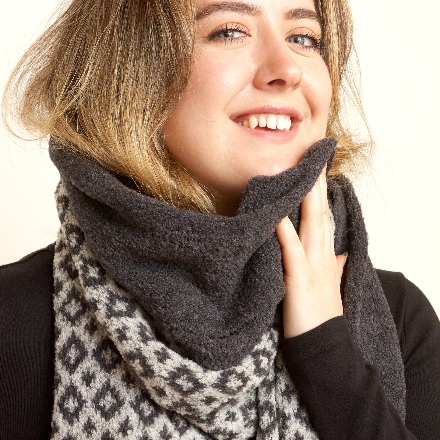 Lovely knitted scarf using luxurious Italian yarn, this 2 colour jacquard pattern scarf is beautifully soft and sumptuous to wear.  The geometric pattern  "Carsphairn" is just the right scale for a scarf and easy to wear. Dove Grey colour shown here worn with plain Charcoal grey scarf.l